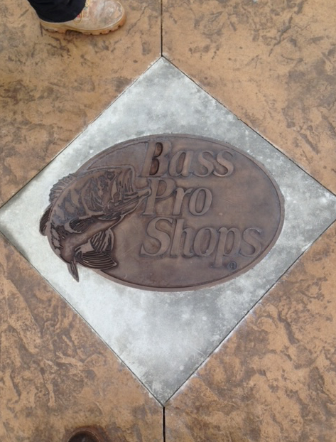 A sign that says bass pro stops on it