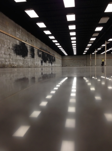 A large room with a lot of lights on the ceiling