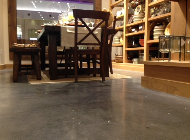 A dining room with a table and chairs in it