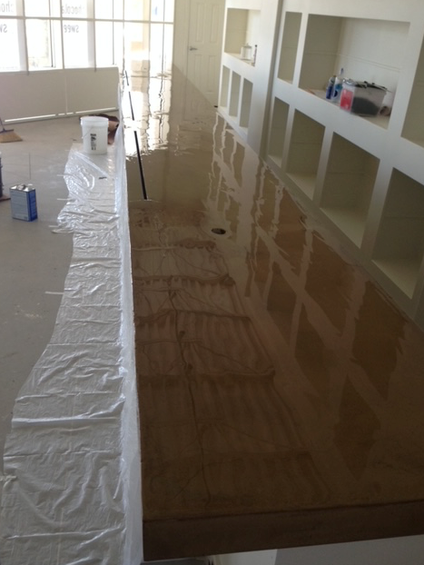 A room with a lot of shelves and a table covered in plastic