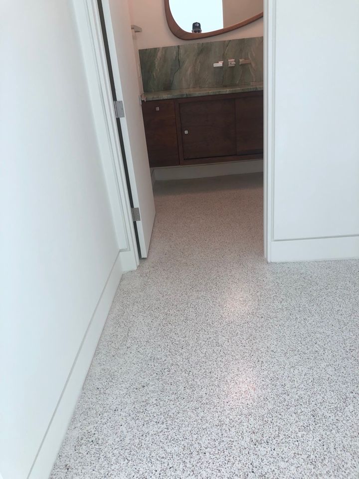 A bathroom with a sink and a mirror on the wall