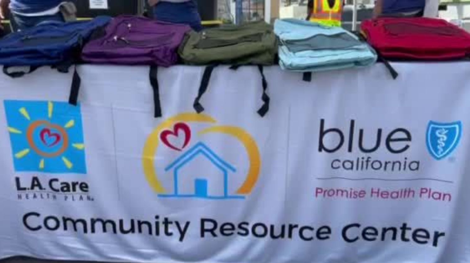 Backpacks on display from L.A. Care and Blue Shield Promise Health Plan giveaway. 