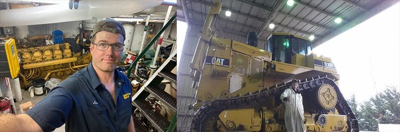 A man is standing next to a large machine in a garage.