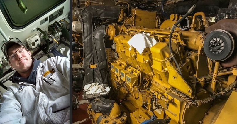 A man is sitting in a cab next to a yellow engine.
