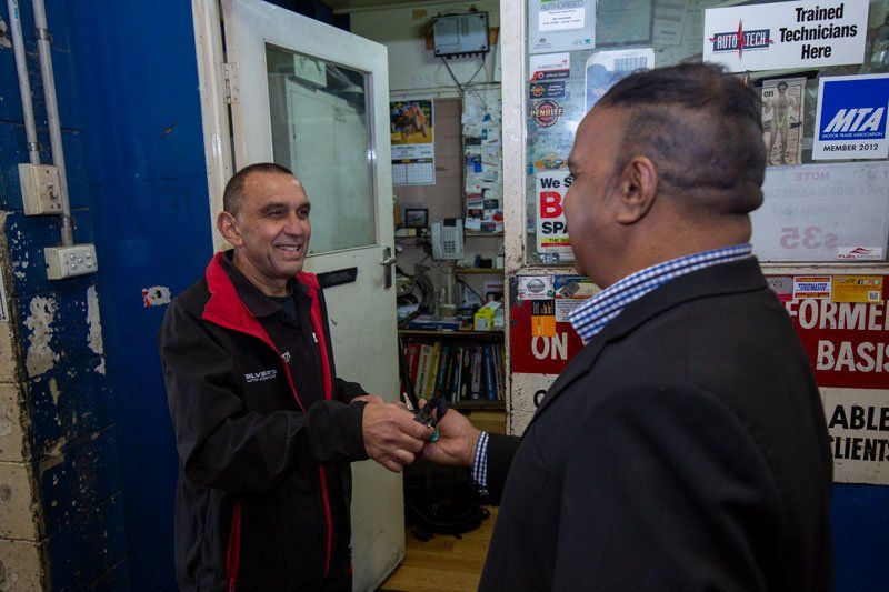 A Man Giving The Car Key- Adelaide, SA - Silver’s Auto Centre