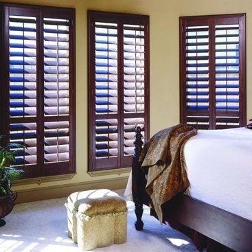 Classic wooden shutters with concealed tilt rods for a clean look.