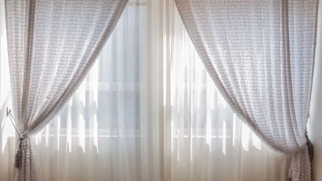 Light-filtering drapery in a tranquil bedroom