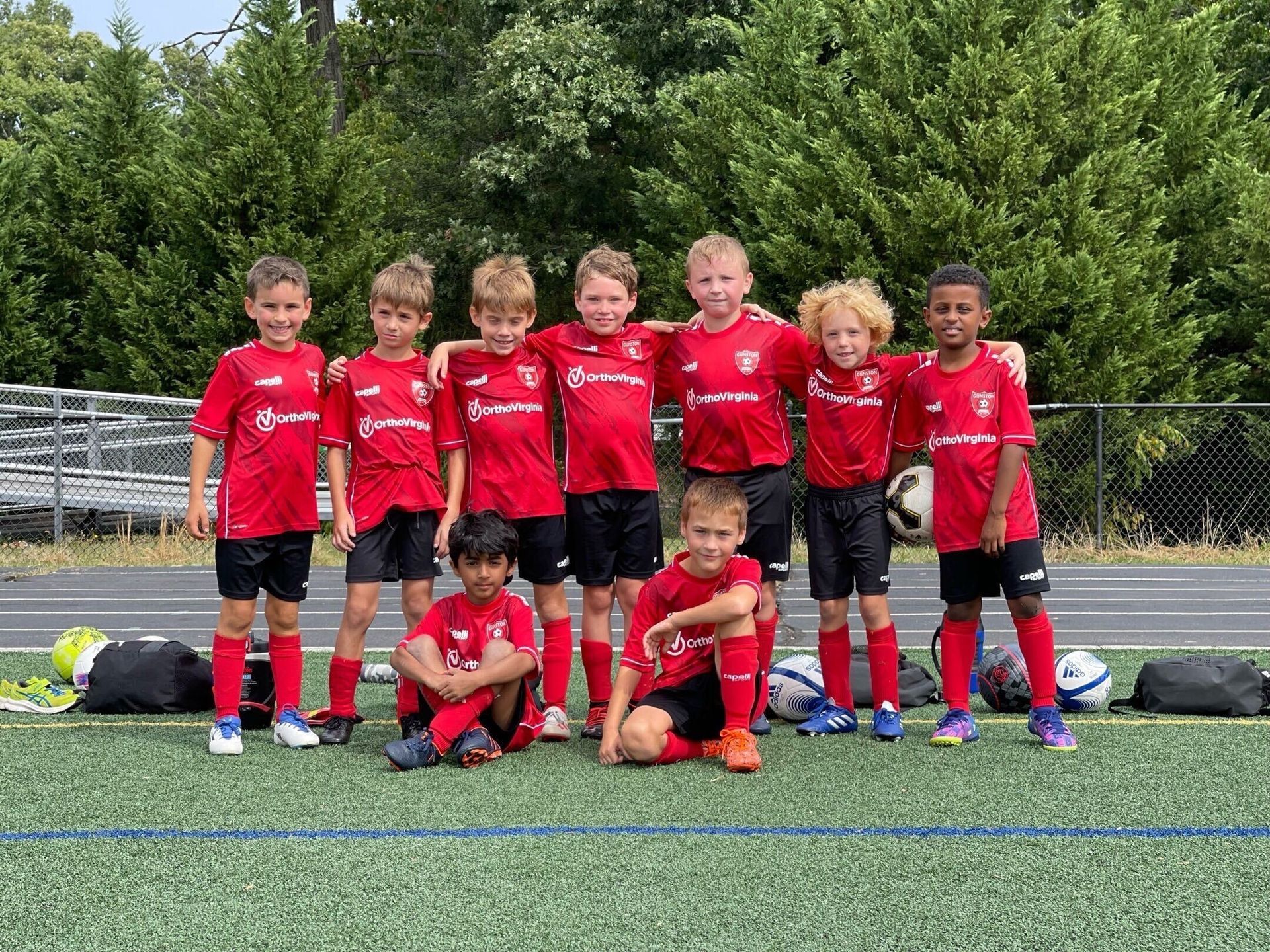 Youth soccer team in red jerseys for Gunston Soccer Club