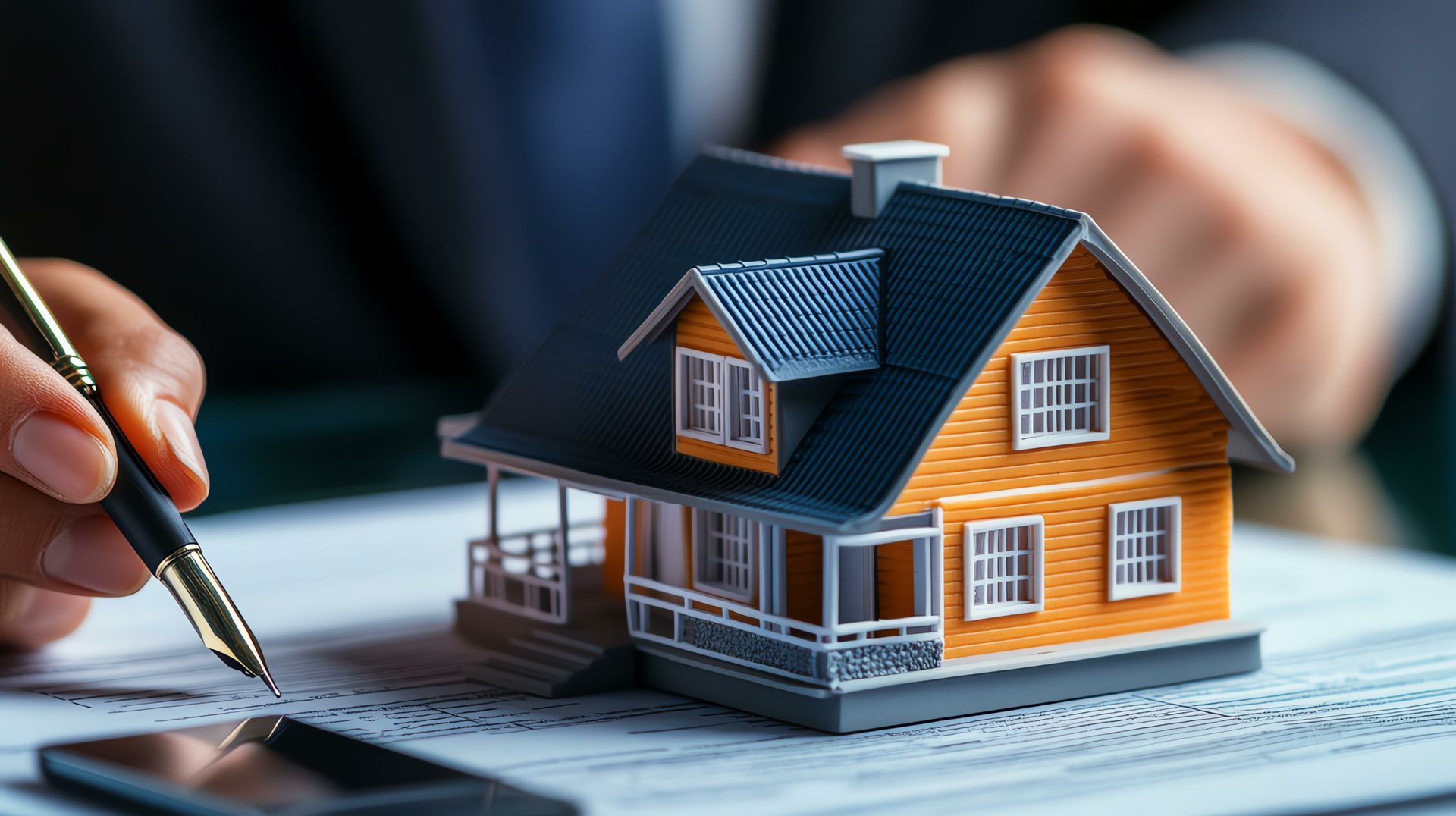 Two men are painting a wall in a room.
