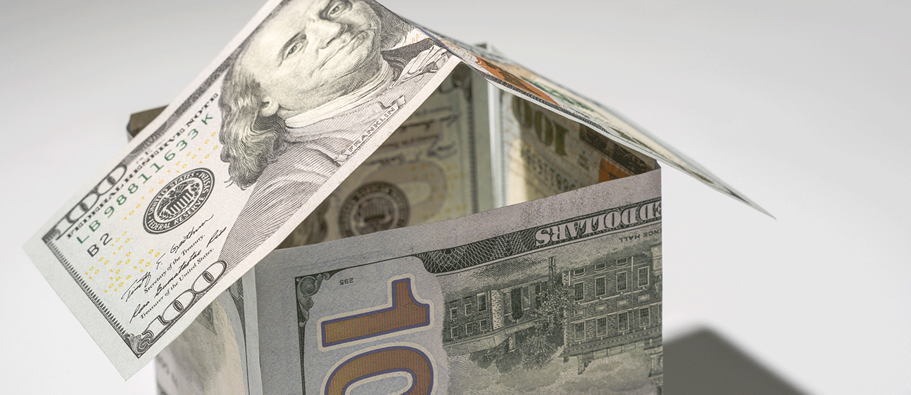 100 dollar bills shaped like a house