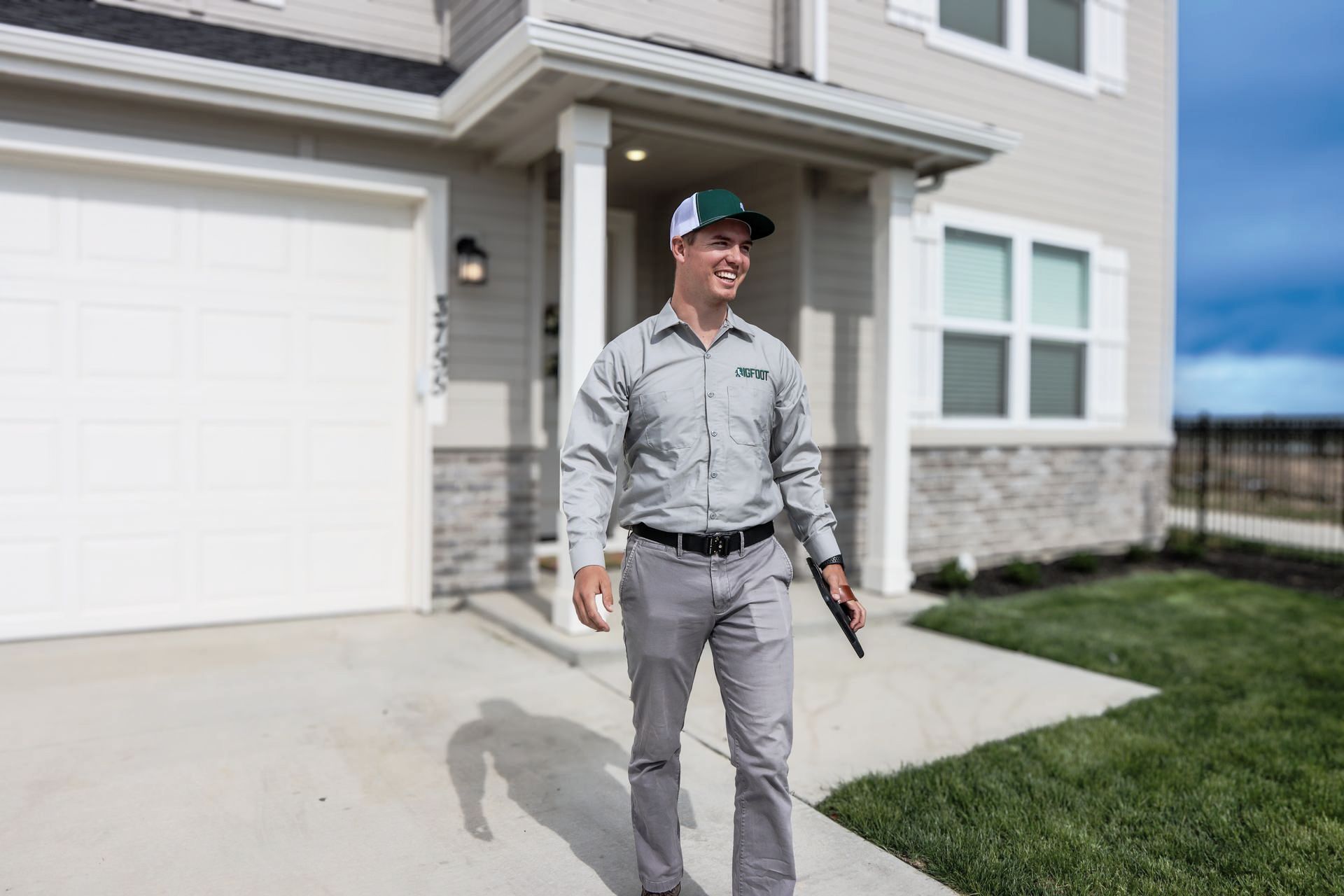 A pest control technician is preparing to treat a home for spiders, ants, wasps, and other bugs and pests.
