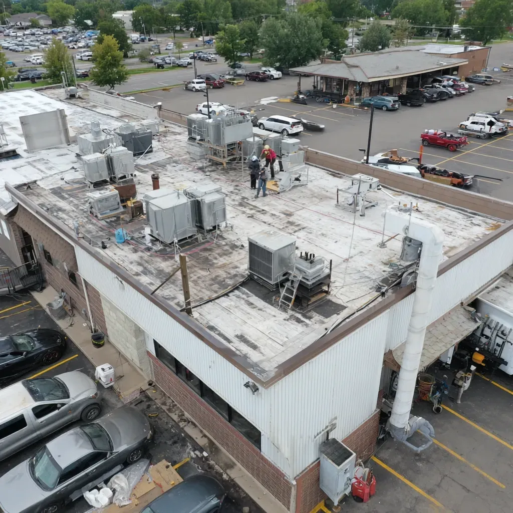 Roofing contractors Joliet IL repair flat commercial roofs with torch-down membrane reinforcement, ponding mitigation, and wet ISO insulation removal.