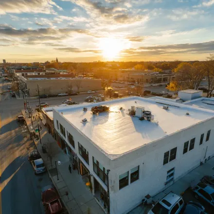 Joliet IL roof leak experts perform thermal imaging, rainwater entry diagnostics, shingle resealing, and chimney cricket flashing installation.
