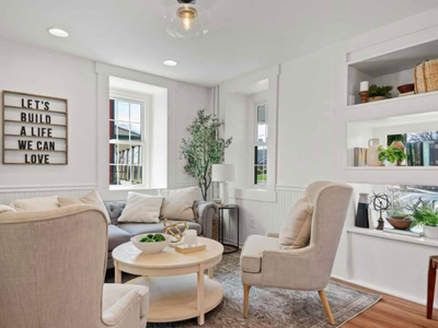 A living room filled with furniture and a sign that says `` let 's build a life we can love ''.