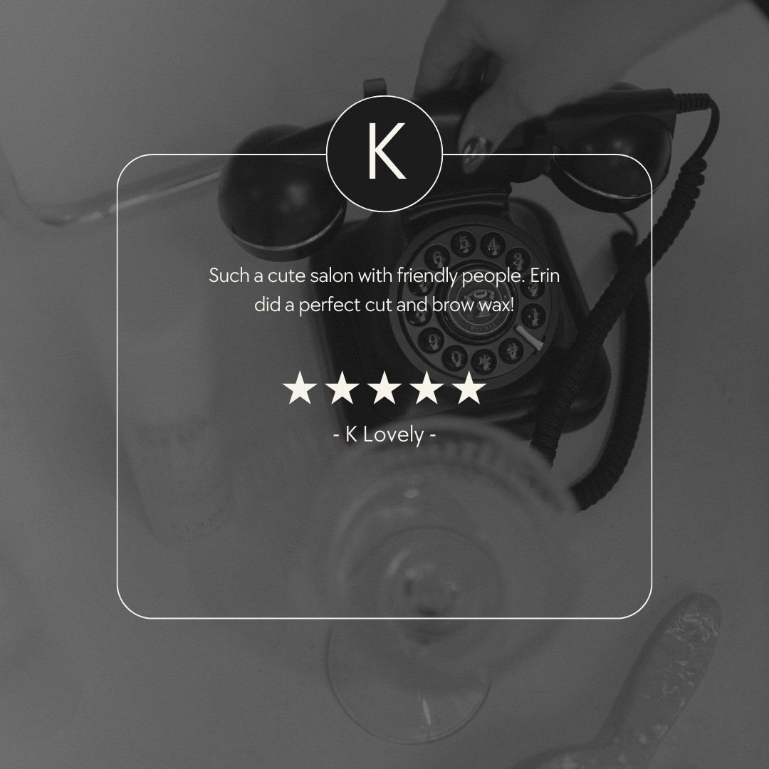 Review overlay with five stars and quote over a black rotary phone and glass.