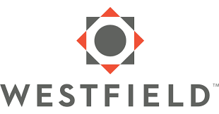 The Westfield company logo featuring a dark grey circle within a diamond shape, flanked by four red triangles.