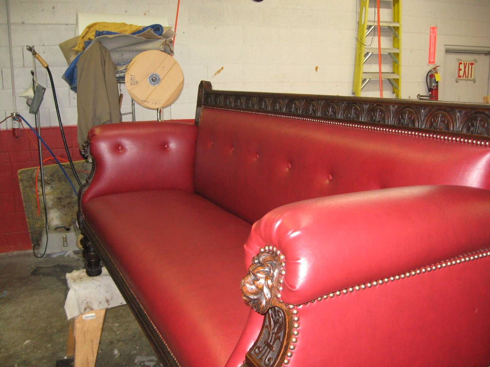 Red Leather Couch With a Lion Head on the Arm Rest — San Jose, CA — Upholstery Specialists