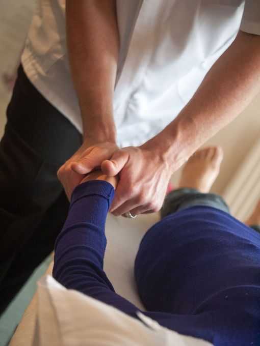 Chiropractic care being given on a person's hand/wrist