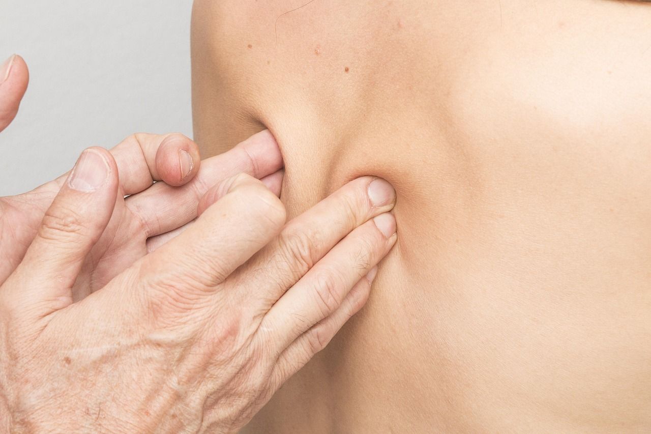The spinal area of a person's back being massaged