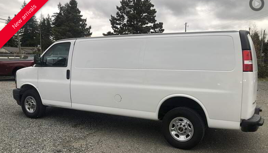 White cargo van parked outdoors. Red “New Arrival” banner in top left.