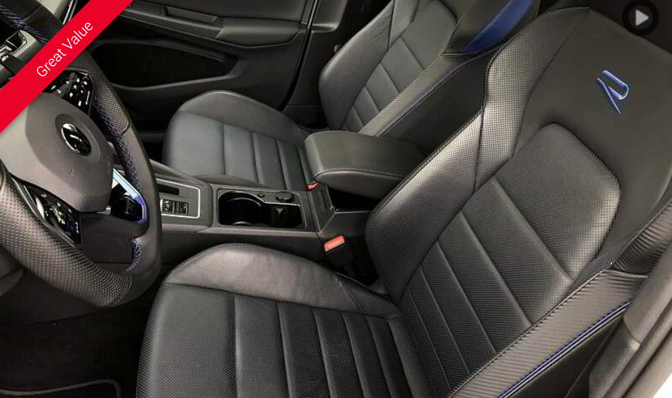 Black leather car interior with blue accents and the letter 