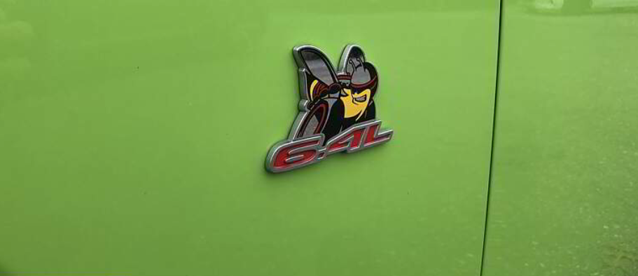 Green car with a chrome and red 