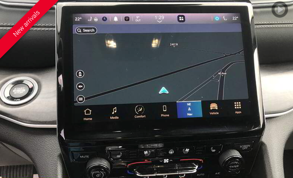 Dashboard with a large touchscreen displaying a navigation map. Features car controls and 