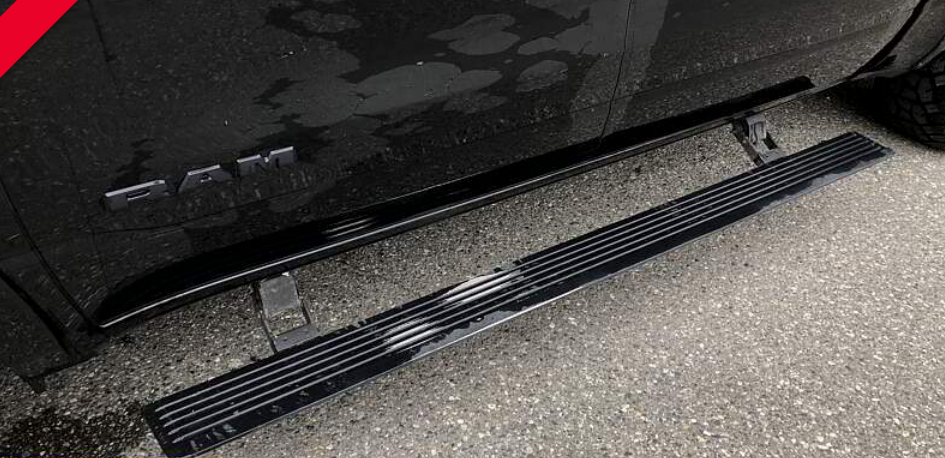 Black truck running board and step removed, on asphalt. 