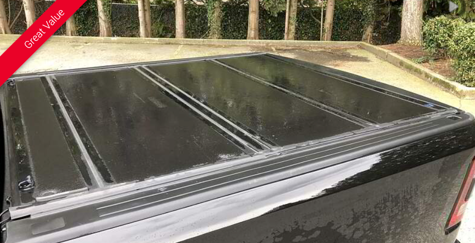 Black truck bed cover with raised panels.