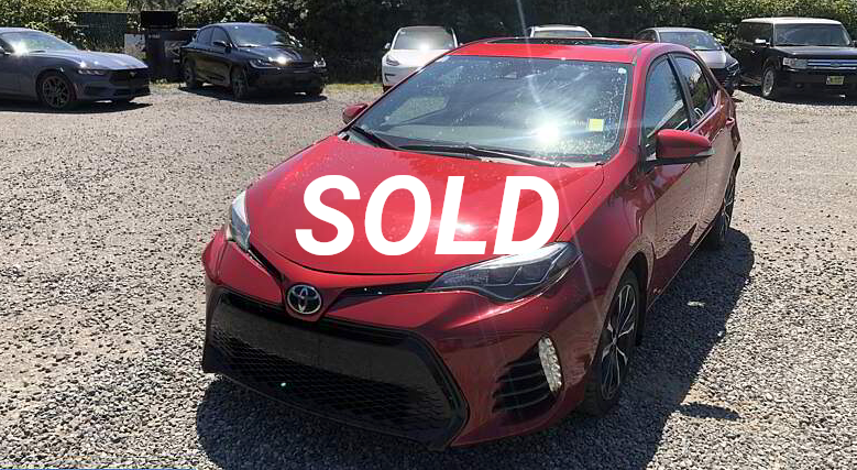 Red Toyota Corolla with 