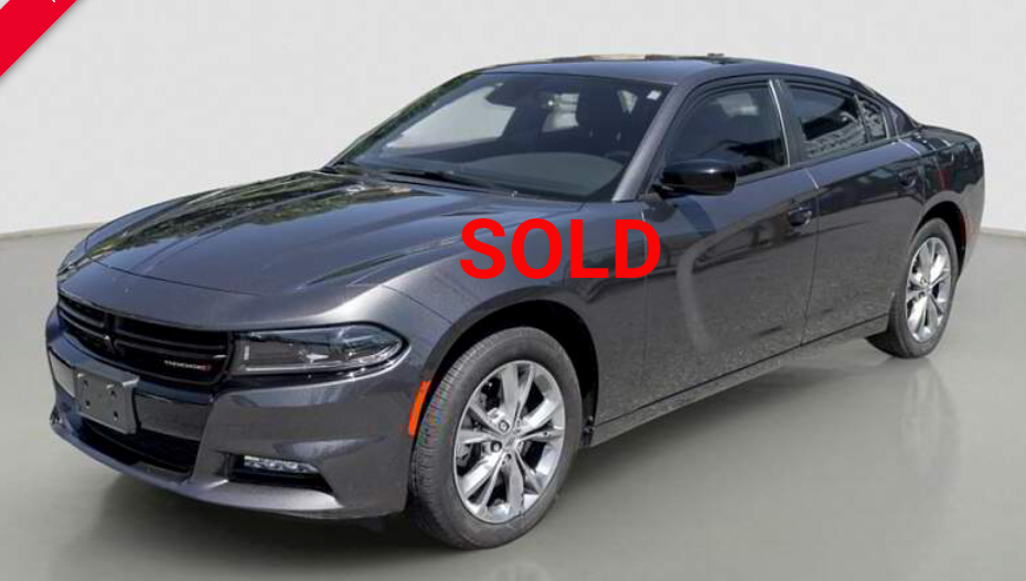 Dark gray Dodge Charger sedan.