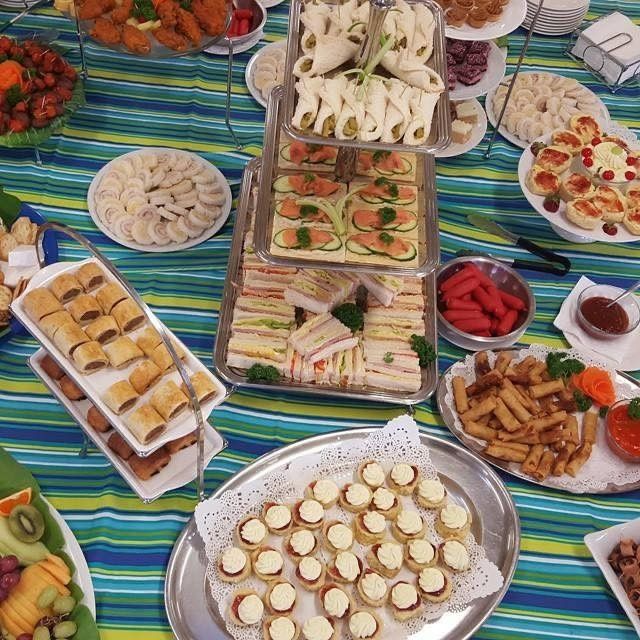 Catering Buffet with Various Appetizers, Sandwiches, and Desserts — Leichhardt Accommodation in Mornington, QLD