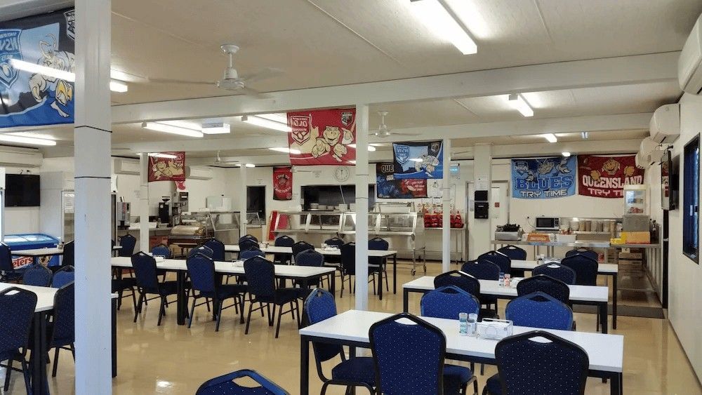 Cafeteria: Tables with Chairs, Serving Counters, and Banners — Leichhardt Accommodation in Mornington, QLD
