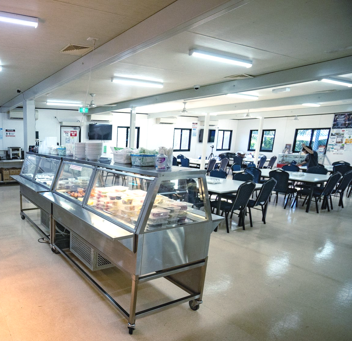 A Cafeteria with Multiple Tables and Chairs, with Food Serving Areas — Leichhardt Accommodation in Mornington, QLD