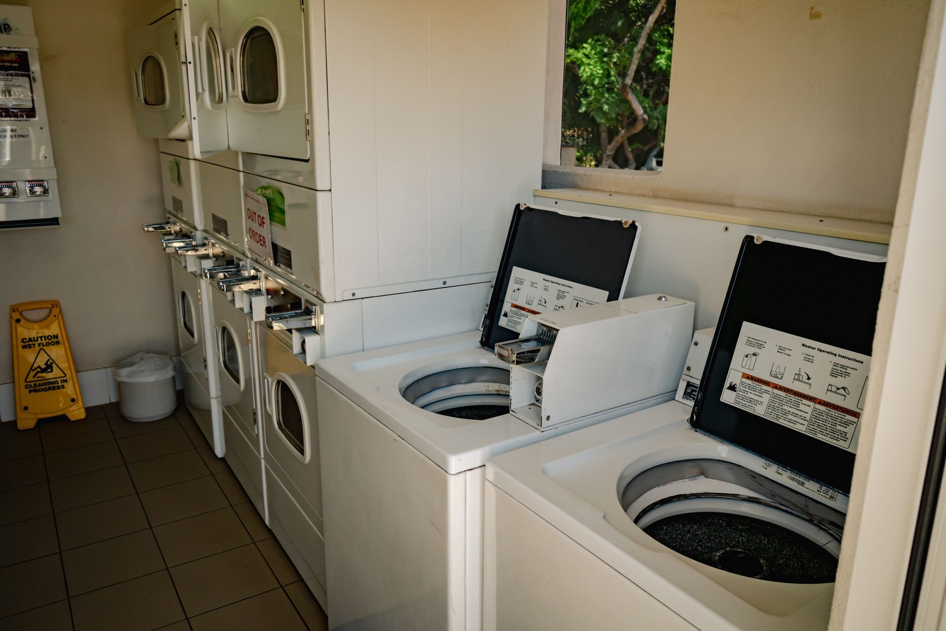 A Playground With Exercise Equipment Under A Blue Umbrella — Leichhardt Accommodation in Mornington, QLD