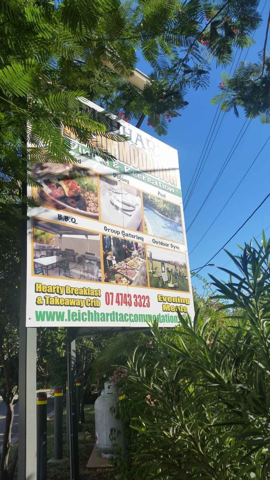 Sign for A Venue with Photos of Food and Scenery — Leichhardt Accommodation in Mornington, QLD
