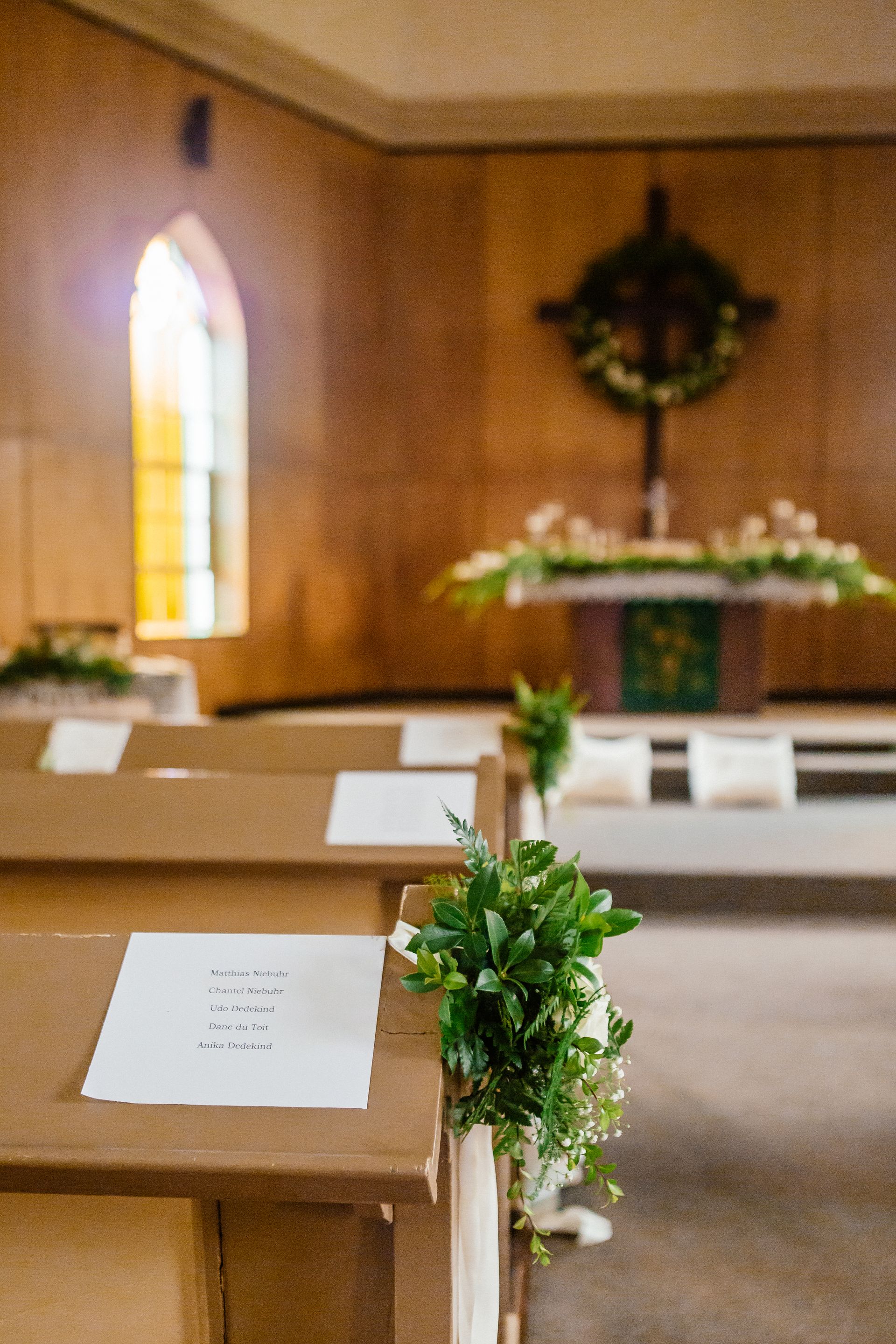 A church with a cross on the wall and a cross on the altar.