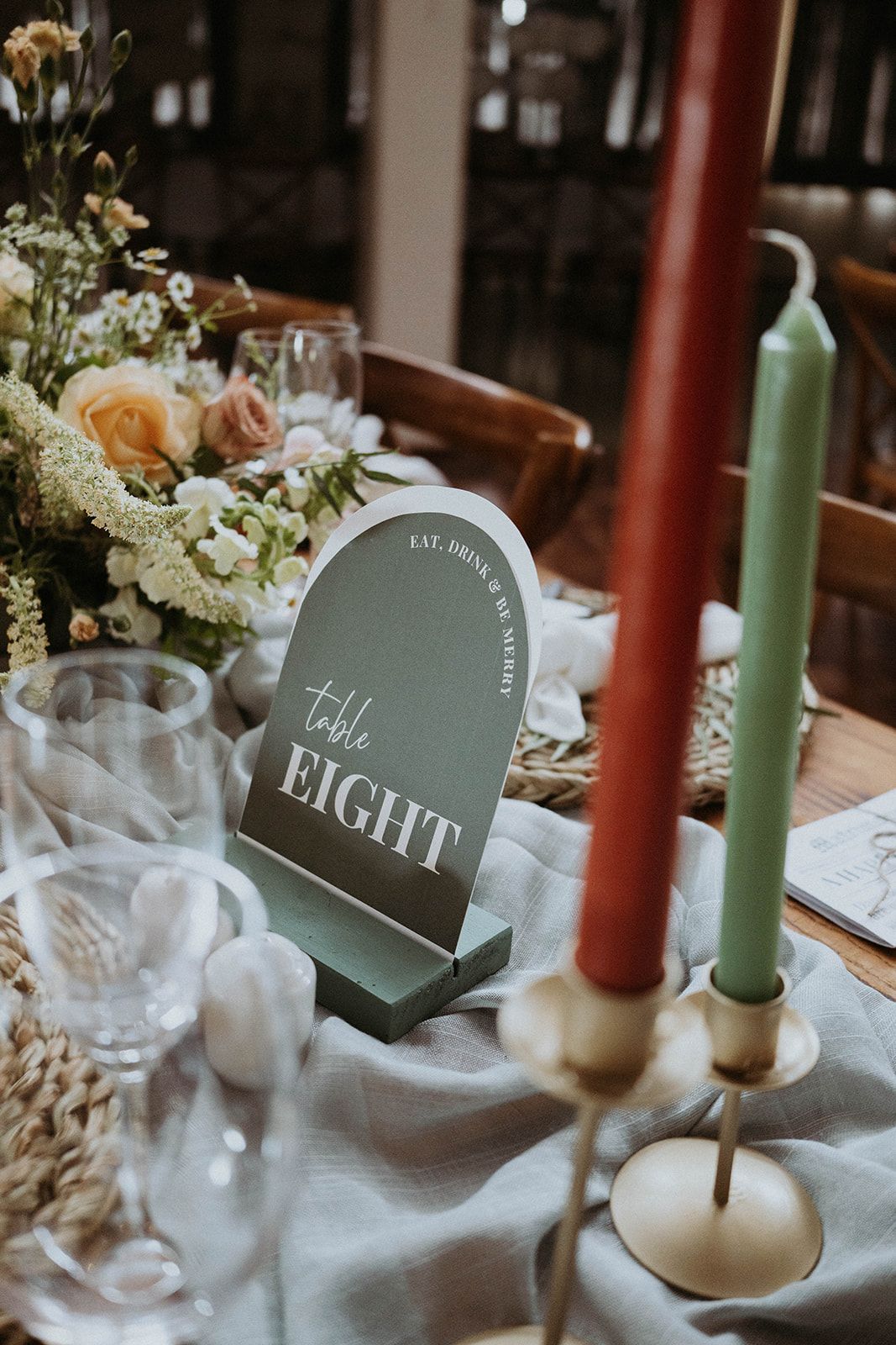 A table with a number eight sign and candles on it.