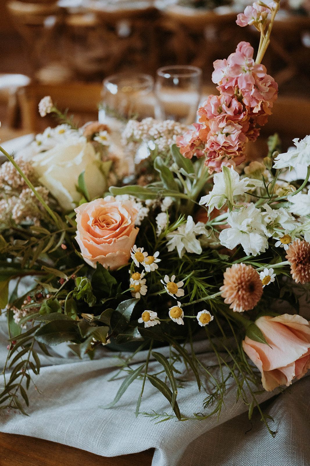 A bunch of flowers are sitting on top of a table.