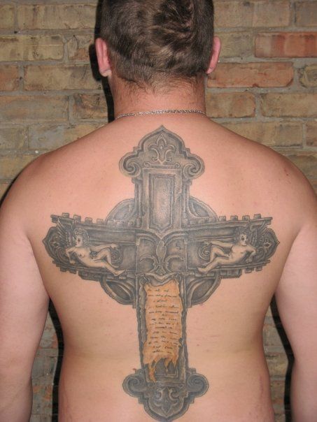 A man has a large cross tattoo on his back
