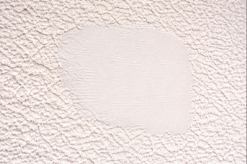 EIFS stucco patch repair blended to match existing exterior finish