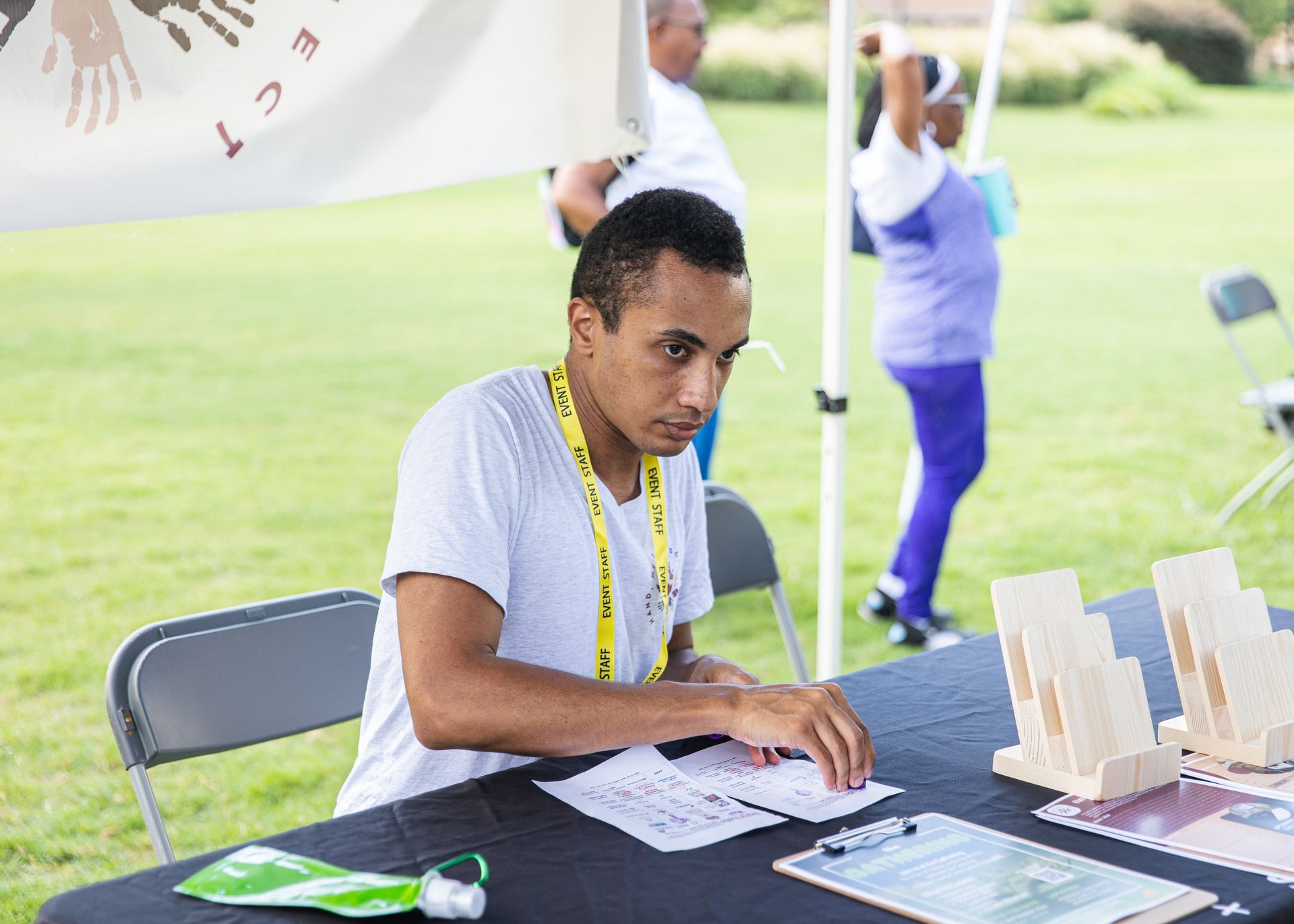 A man is sitting at a table with papers on it.