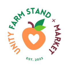 A woman wearing a mask is standing in front of a little lion farmstand.