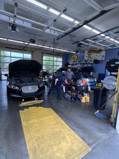 Pouring Oil To Car Engine — Morristown, TN — Express Lane Oil West