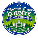 The logo for the monticello-jasper county chamber of commerce is a black and white drawing of a building.