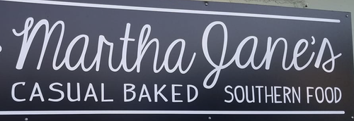 A sign for martha jane 's casual baked southern food