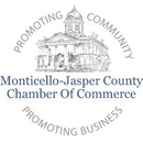 The logo for the monticello-jasper county chamber of commerce is a black and white drawing of a building.