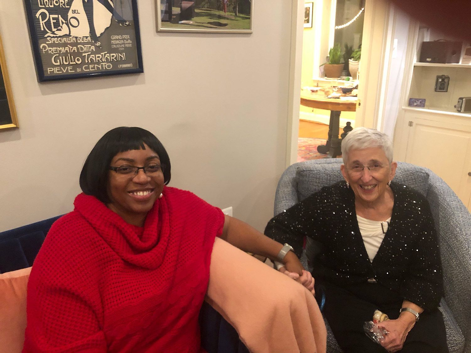 Two Women Sitting on a Couch