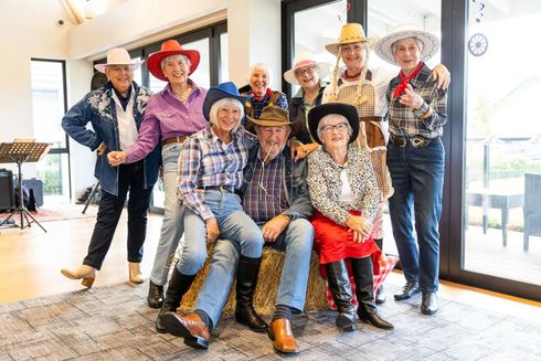 Residents enjoying cowboy theme event