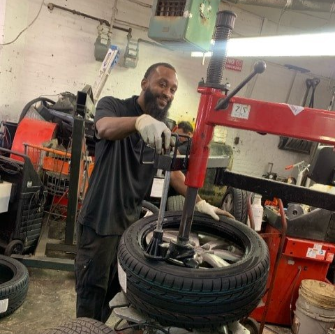 Technician Working on Customer's Tire